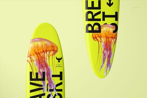 PSD mockup of longboard surfboards with vivid jellyfish illustration and prominent black text, displayed on a yellow background.