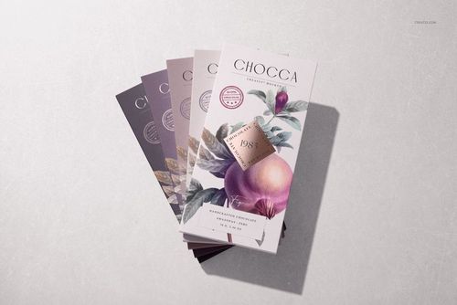 Chocolate bar packaging mockup set showing elegant leaf and fruit designs, displayed on a textured pale background.