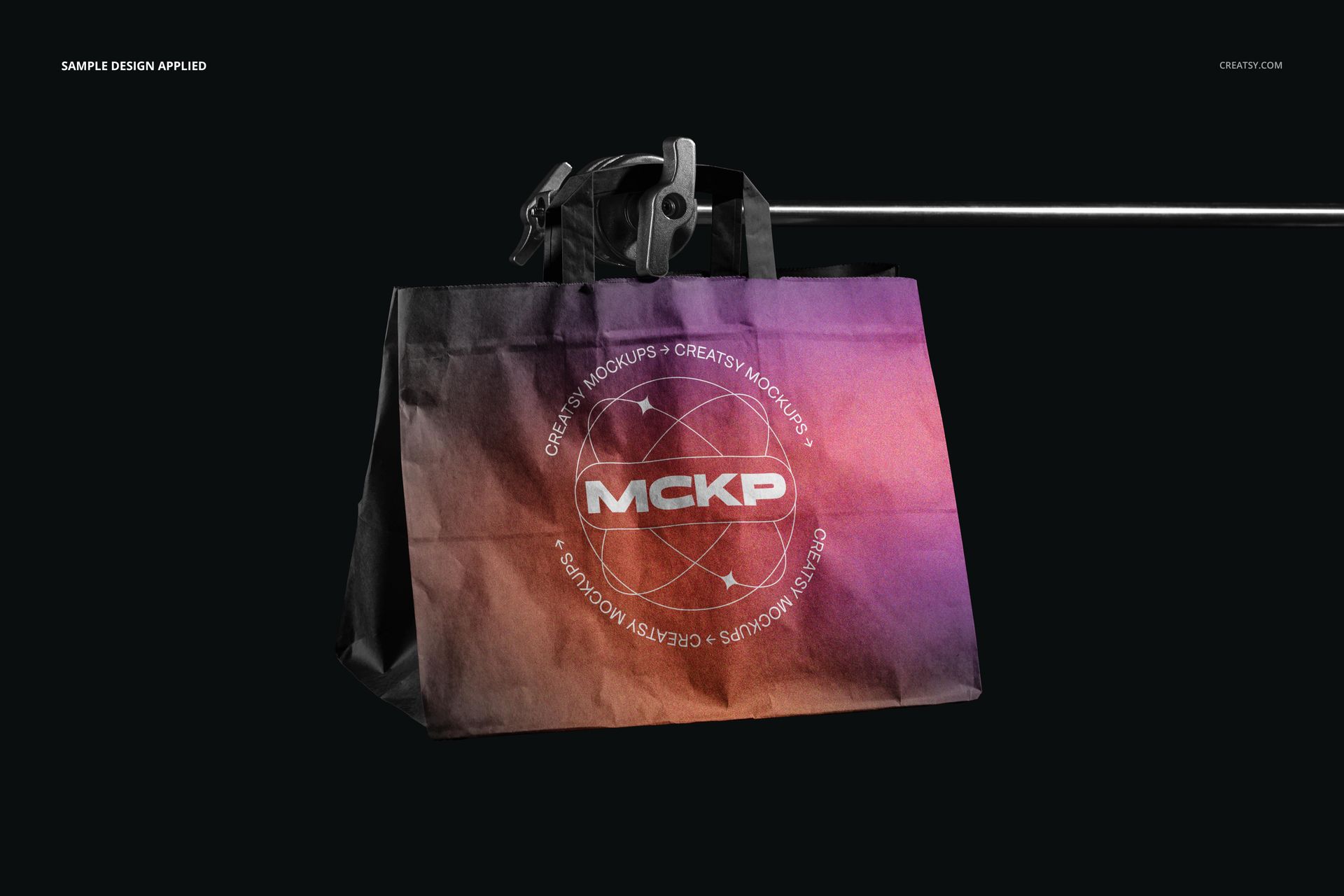 Front-facing flat handles paper bag mockup featuring a colorful gradient pattern, displayed in a studio environment.