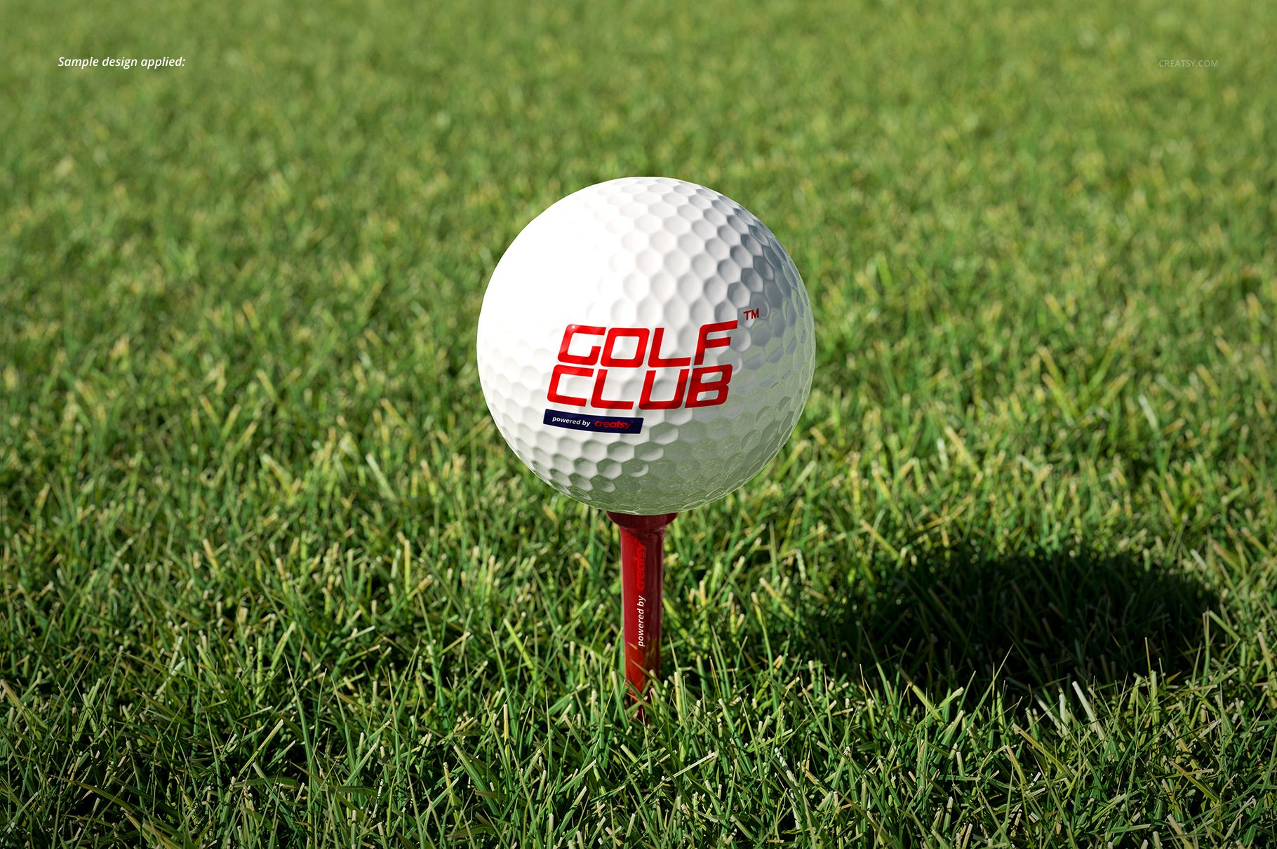 Front view of a golf ball mockup featuring a red tee and green grass background, suitable for PSD mockup designs.