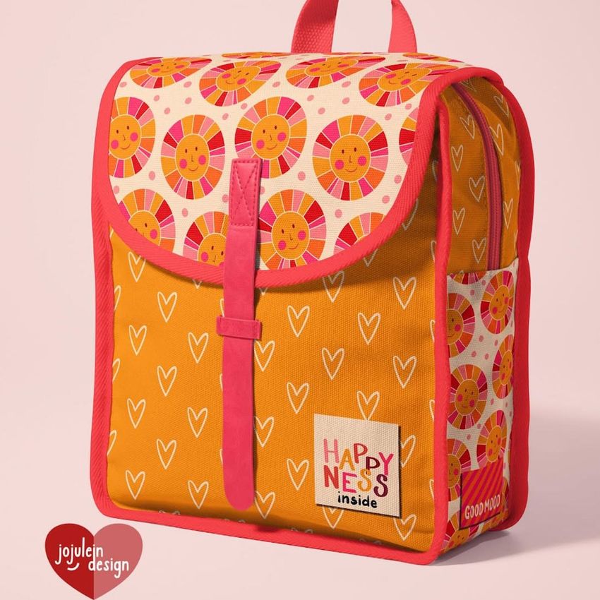 Kids backpack mockup featuring a colorful design with smiling sun patterns and white hearts on orange and pink fabric.