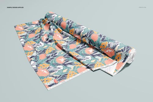 PSD mockup of a fabric roll with a leafy and floral print in pastel colors, viewed from a diagonal perspective.