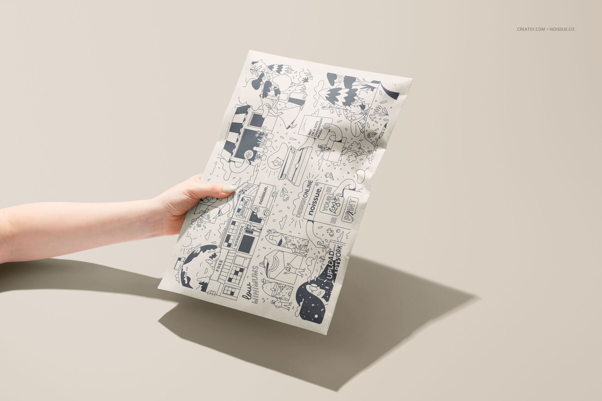Front view of a kraft mailer mockup with whimsical blue graphics, held by a hand on a neutral background.