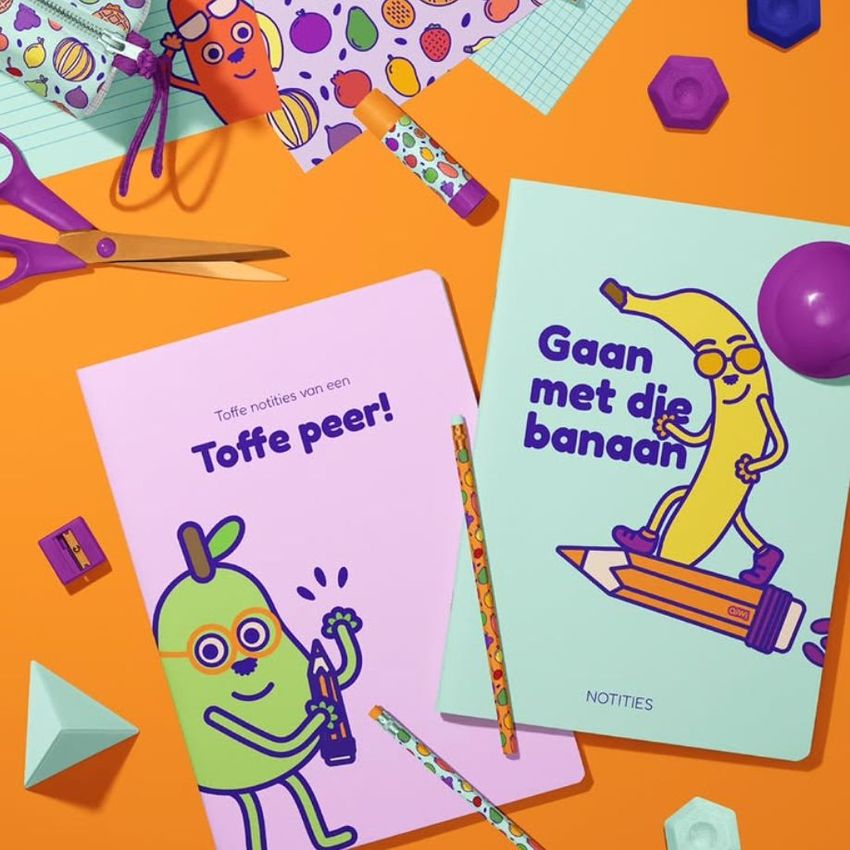 Stationery mockup featuring two A4 notebooks with playful fruit illustrations and bold colors on an orange background.