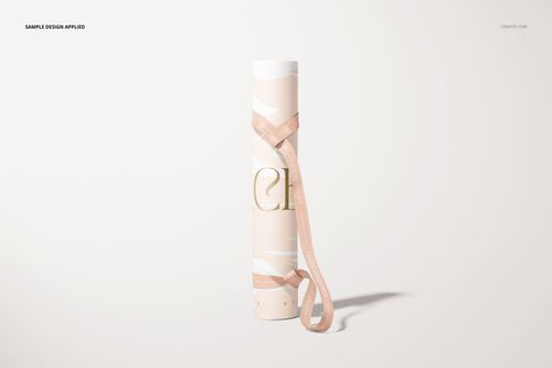 Yoga mat mockup featuring a rolled mat with soft pink and white design, shown upright with a pink carrying strap.