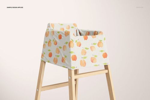 PSD mockup of a multi-use cover featuring a peach motif, displayed on a light wood high chair against a plain background.