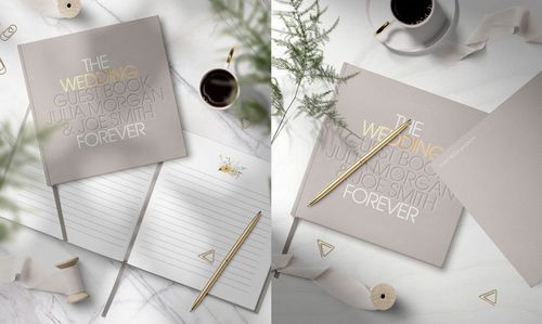Wedding guest book mockup displayed on white marble background, featuring gold accents and decorative props.