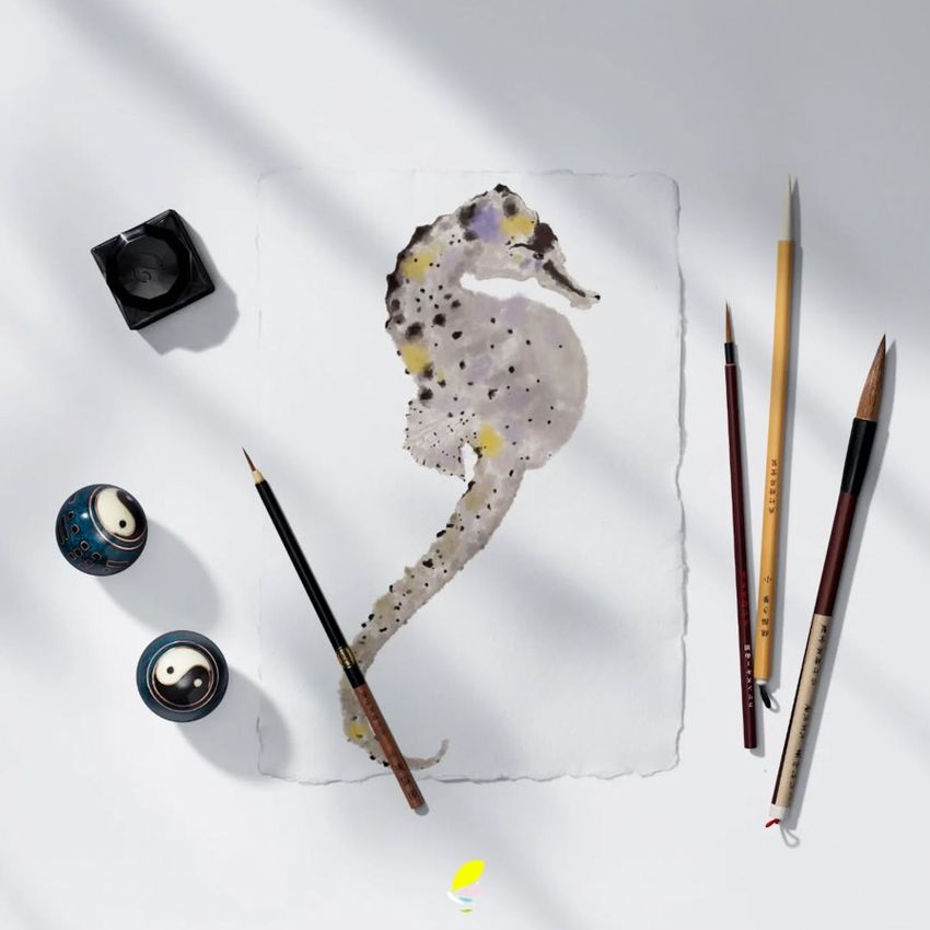Japanese calligraphy mockup showing a watercolor seahorse painting on textured paper, surrounded by brushes and ink pots.