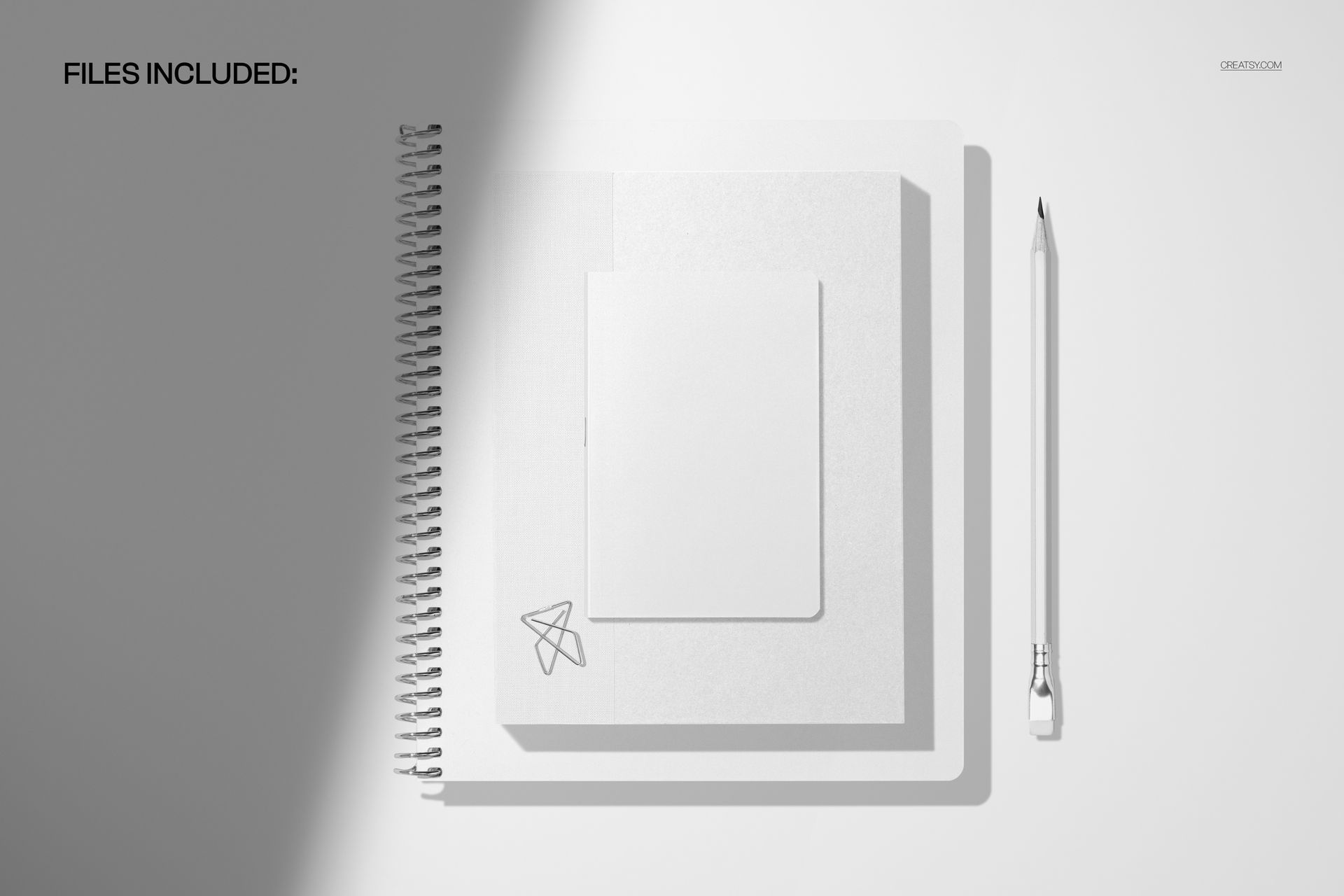 Top view of a spiral notebook planner and small notebook mockup in white, with a pencil placed beside them on a light surface.