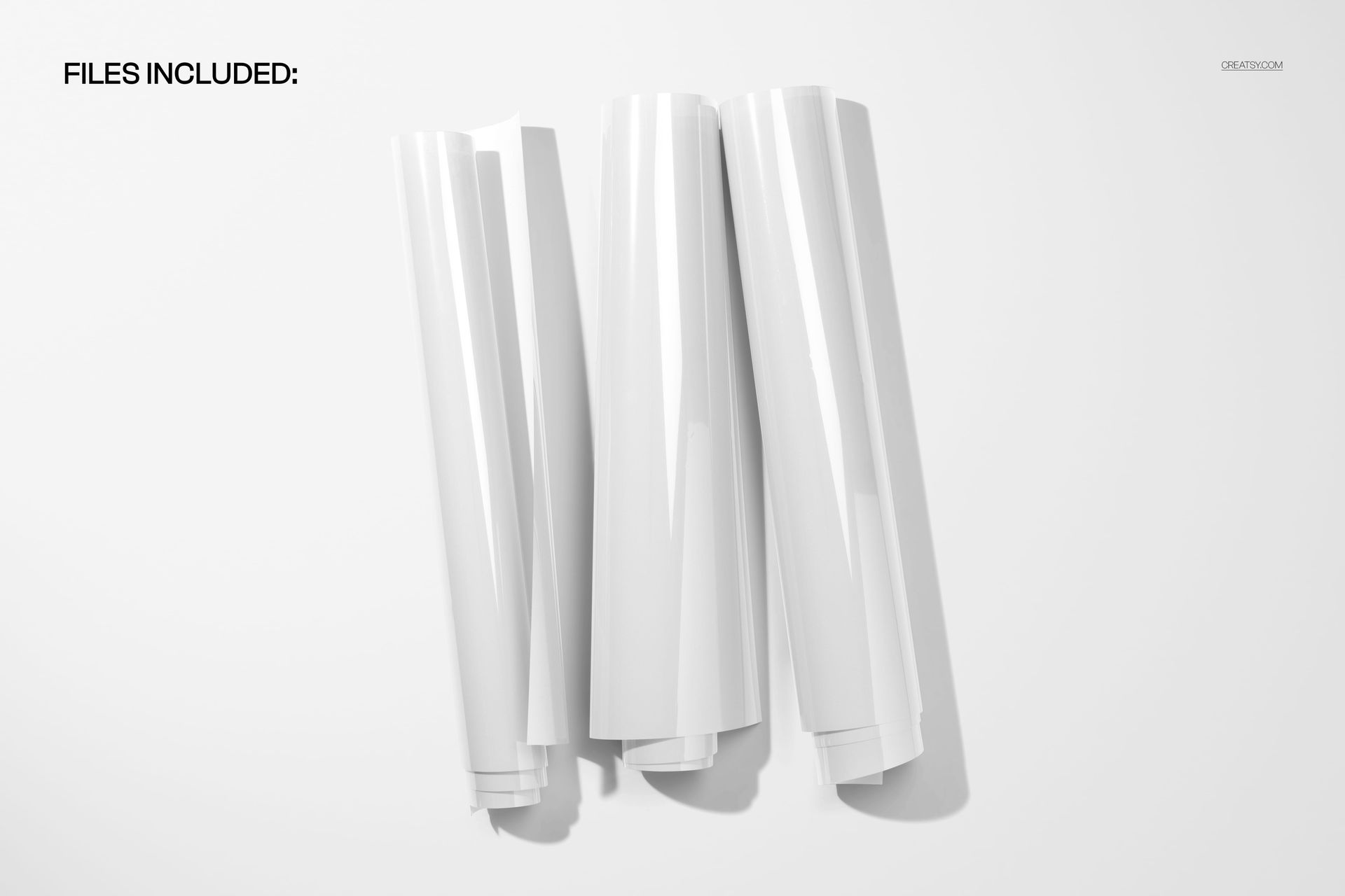 Rolled PVC poster mockup featuring three shiny white posters grouped together against a plain background.