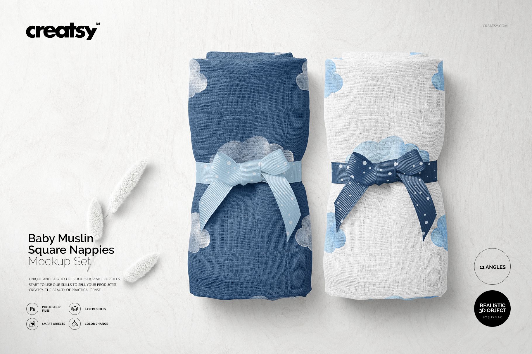 PSD mockup showing two baby muslin nappies, blue and white with cloud motifs, displayed side by side on a light background.