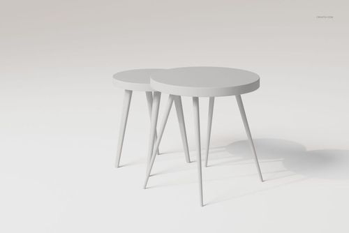 Two round nesting tables with sleek, angled legs in a minimalist light gray setting, shown from a front angle.