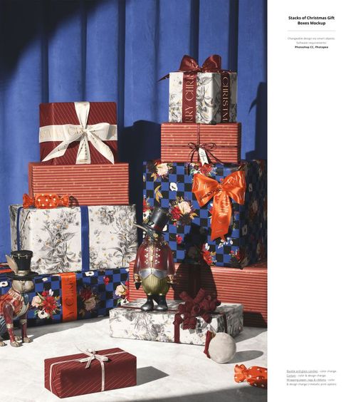 Assorted wrapped presents with decorative ribbons and holiday designs, displayed in a PSD mockup scene with blue curtain.