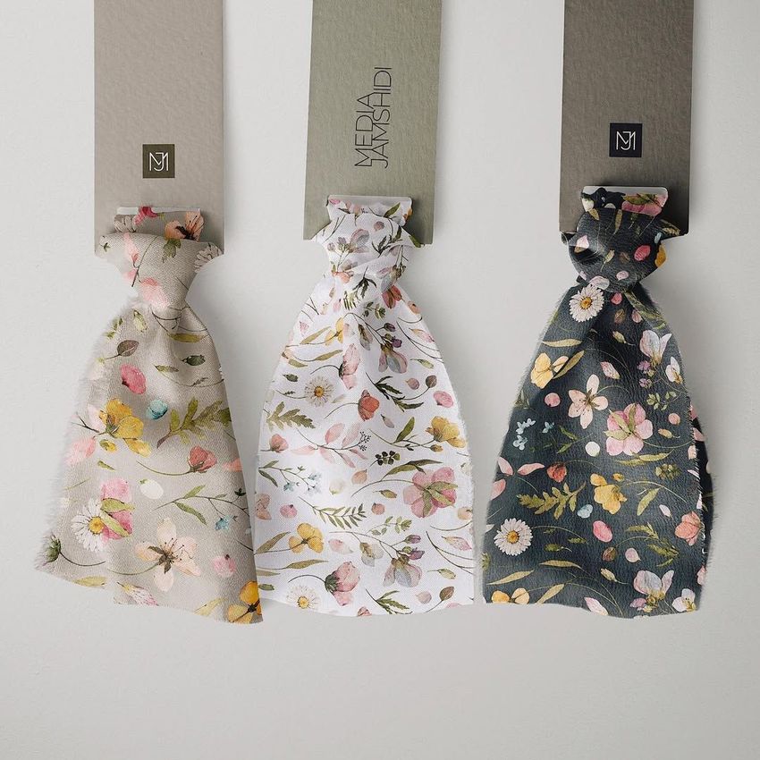 Silk ribbons mockup showing three fabric samples with floral patterns, each attached to a labeled card on a light background.