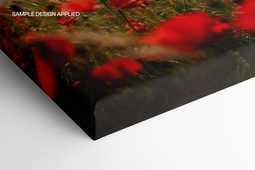 Detailed view of a mockup canvas with a matte finish, showing red flowers and green stems on the print surface.