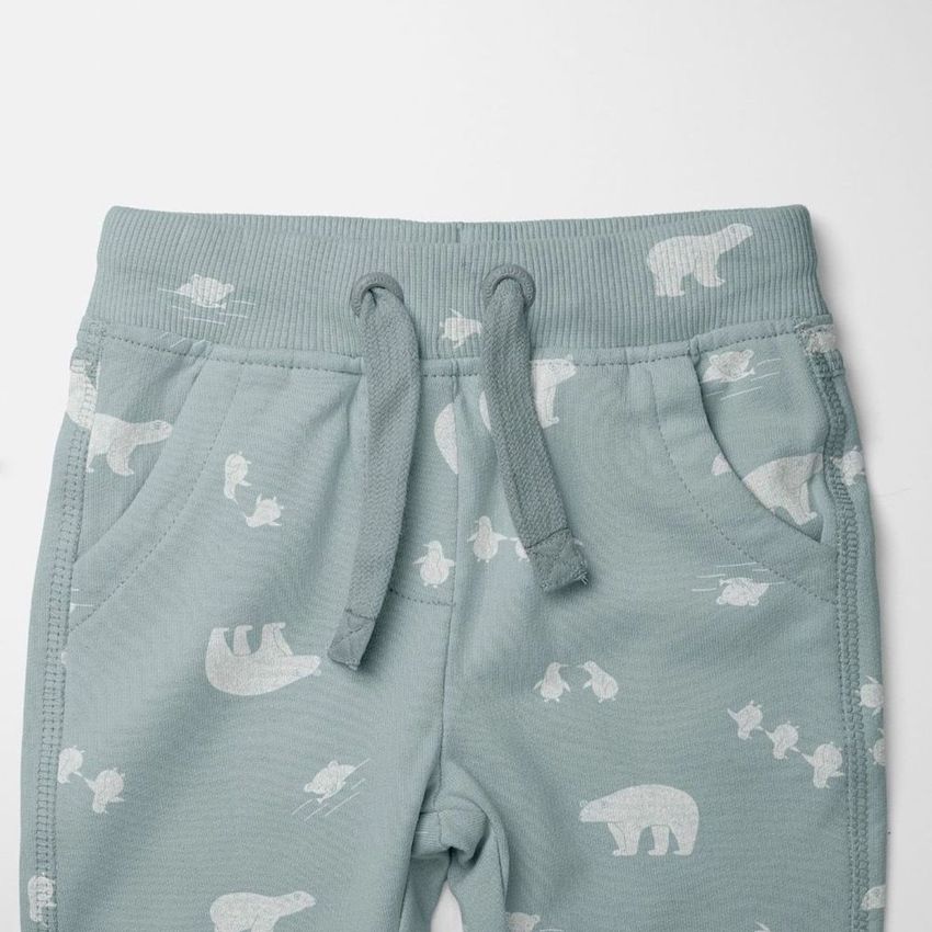 Baby sweatpants mockup featuring light blue pants with white polar bear and sled pattern, shown from the front on a plain background.