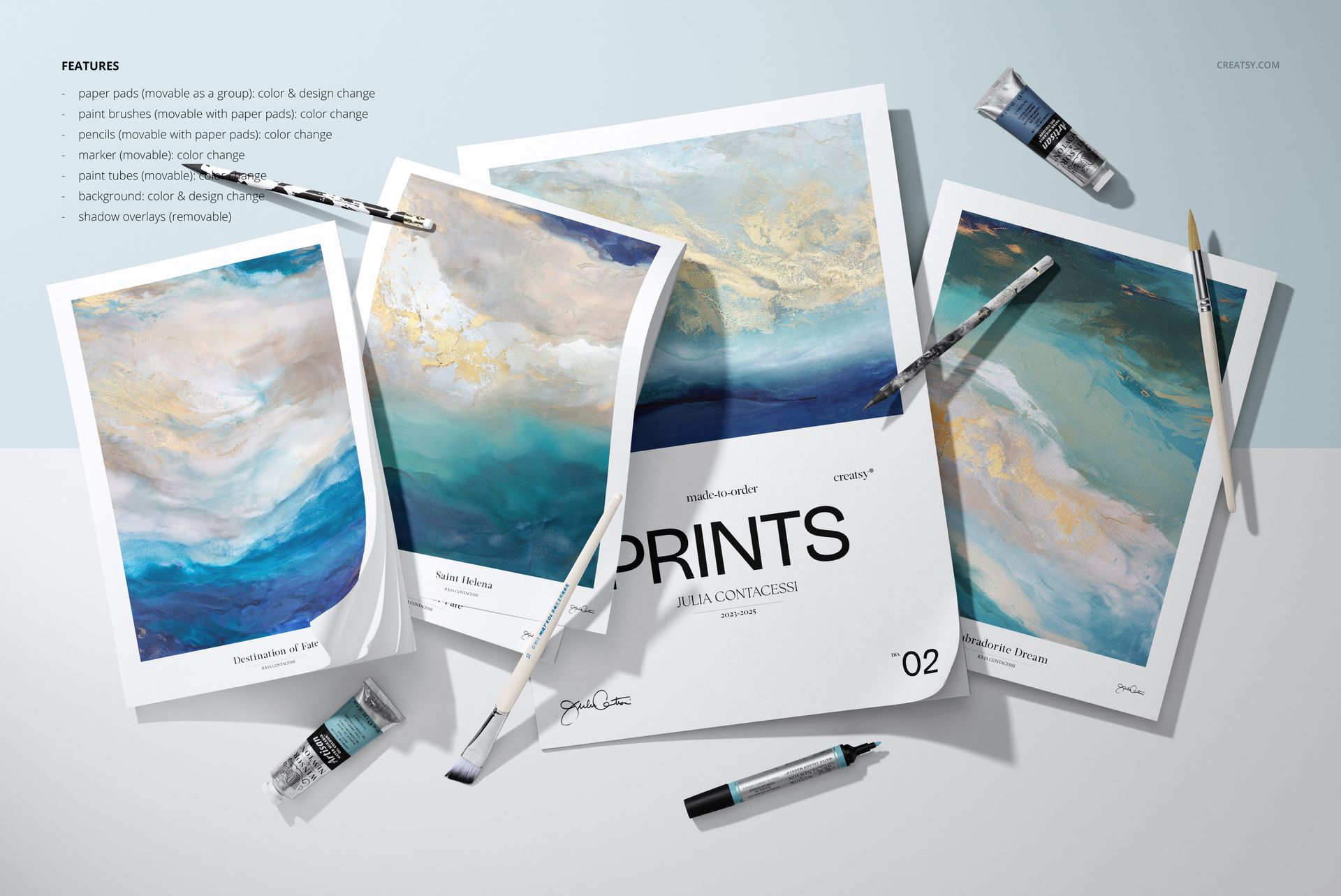 Top view of art paper mockups featuring colorful abstract artwork, paintbrushes, pencils, and scattered paint tubes.