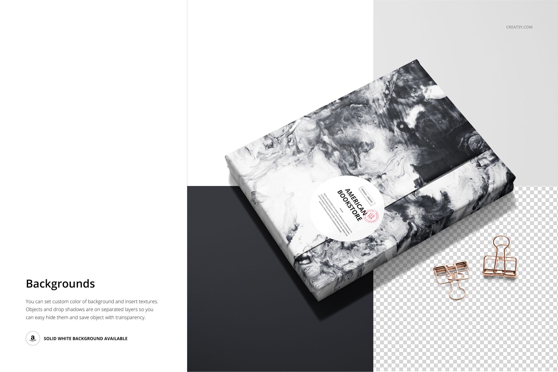PSD mockup of a book covered in abstract black and white wrapping paper, viewed from above with desk accessories.