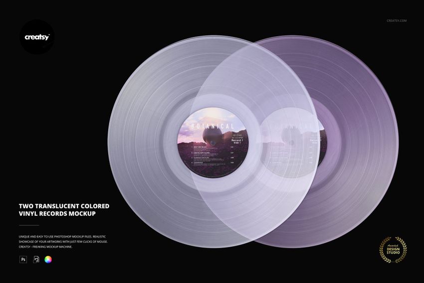PSD mockup featuring a pair of translucent vinyl records with colored surfaces and detailed grooves, set against black.