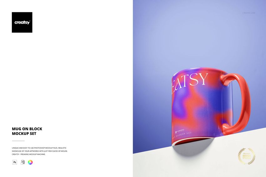 PSD mockup of a glossy mug with bold colors and abstract shapes, shown from a front angle on a white block surface.