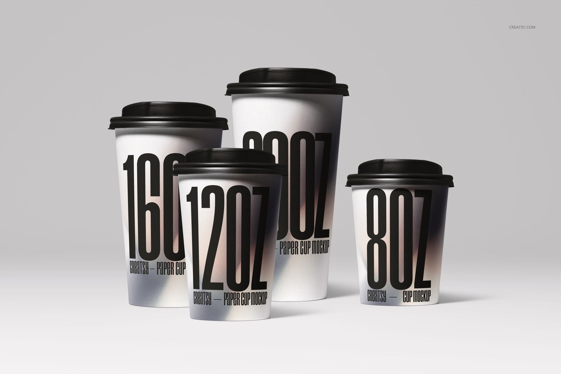 PSD mockup of drinkware cups in different sizes, displaying modern black typography and a minimal white scene.