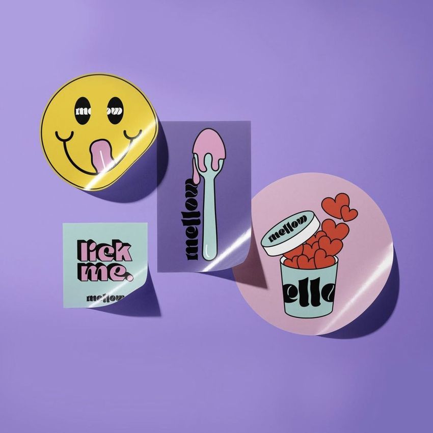 Sticker mockup featuring four colorful stickers with playful designs and text, arranged on a purple background with soft shadows.