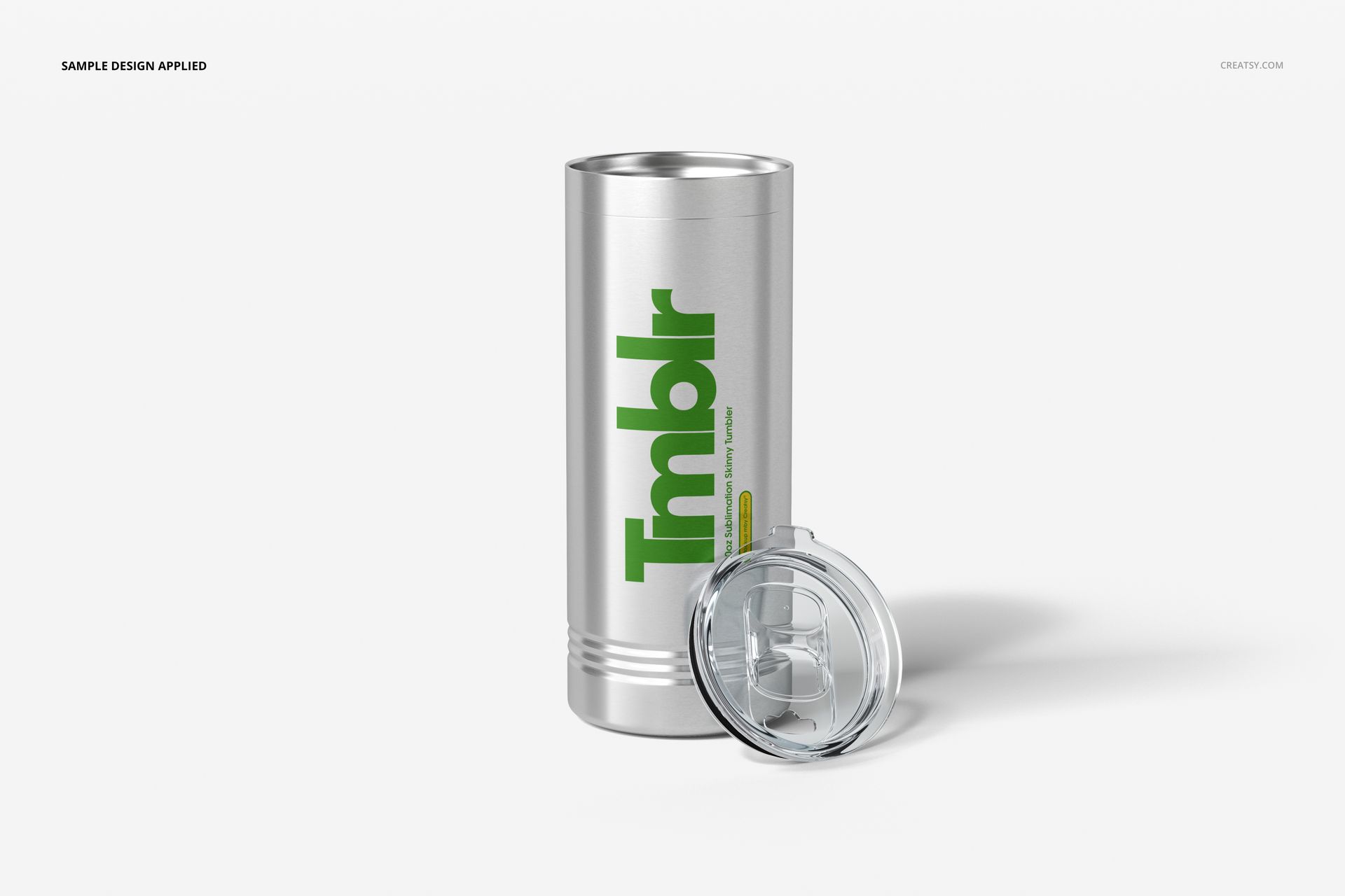 22oz stainless steel tumbler mockup standing upright with a transparent lid placed beside it on a white surface.