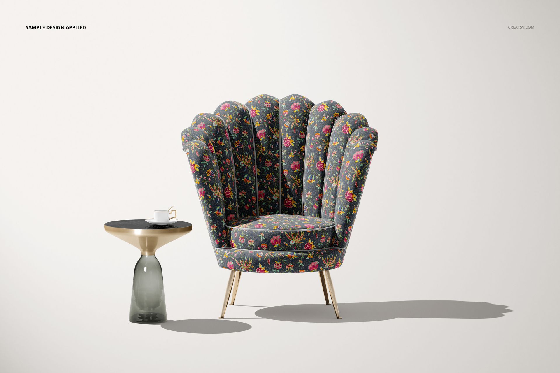 Velvet shell armchair mockup featuring a scalloped backrest with vibrant floral upholstery, paired with a modern side table.