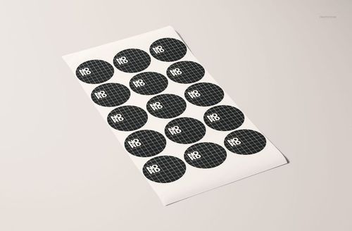 Round sticker mockup featuring black circular stickers with grid lines and white lettering, arranged on a white sheet.