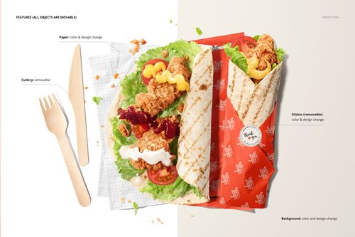 Mockup scene showing a tortilla partially wrapped in printed food safe paper, surrounded by lettuce, fried chicken, and wooden utensils.