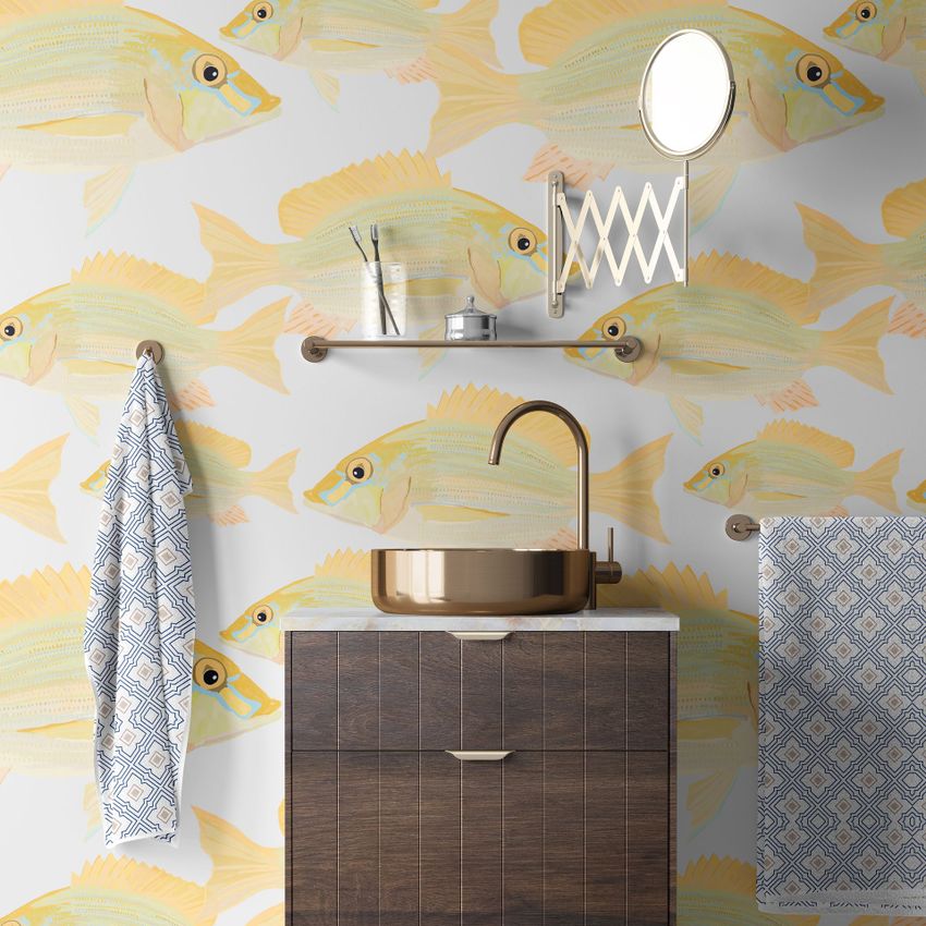 Bathroom wallpaper mockup showing a vanity with a copper sink, patterned towels, and yellow fish wallpaper on the wall.