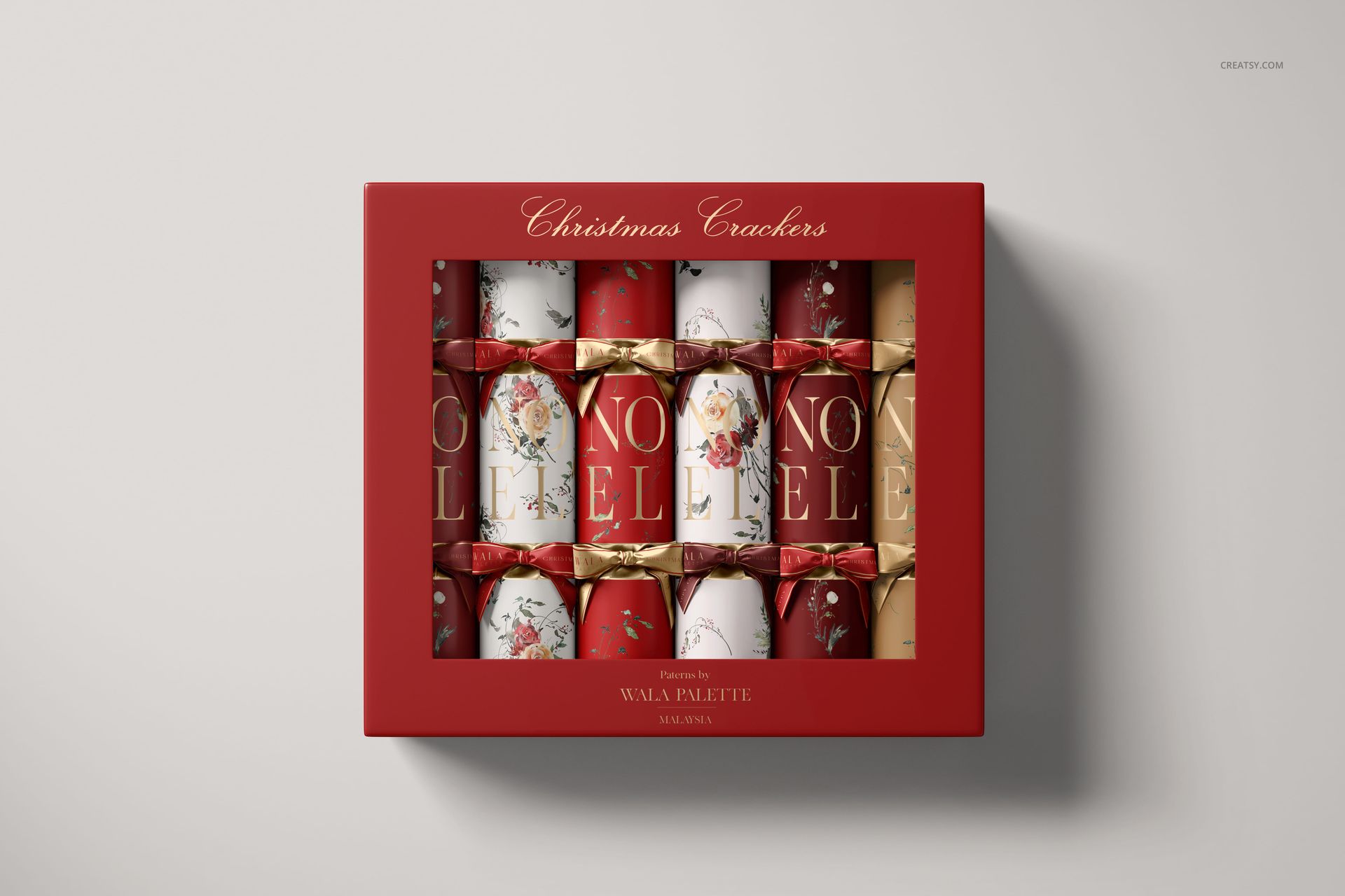 Top-down perspective of a Christmas cracker mockup set in a red rectangular box, featuring assorted holiday designs.