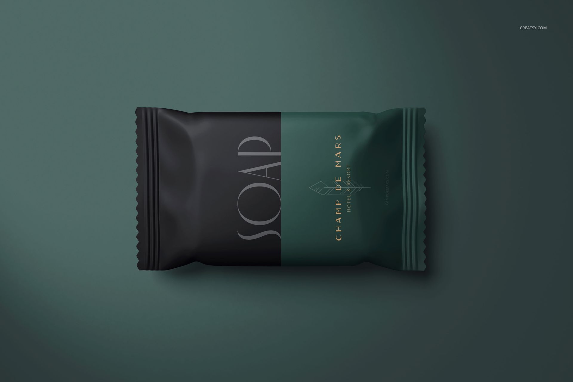 Top view of a hotel hand soap mockup with elegant dark green and black wrapper, placed on a solid green surface.