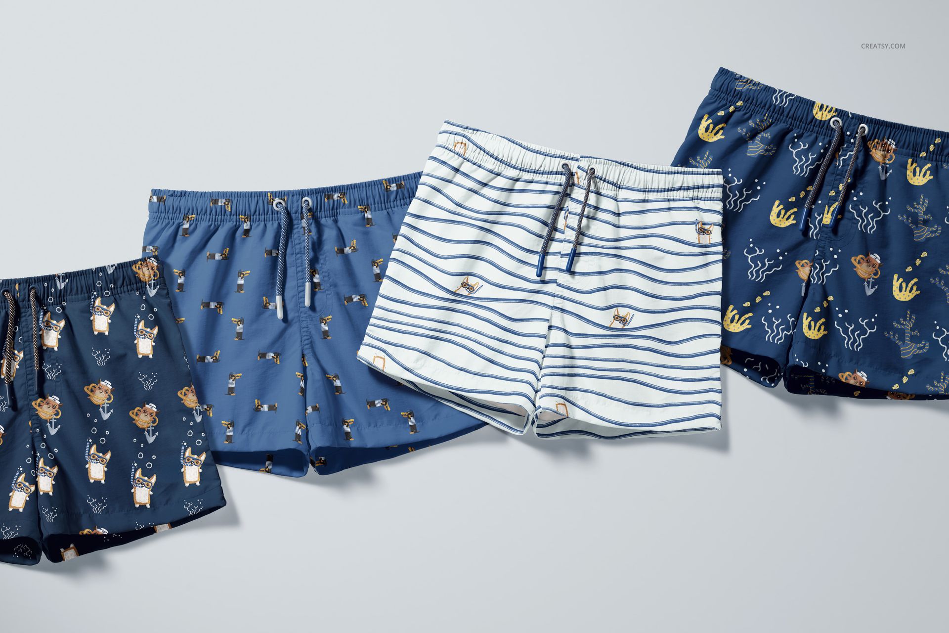 Front view of a PSD mockup set showing kids swim shorts with various aquatic and animal prints in blue and white colors.