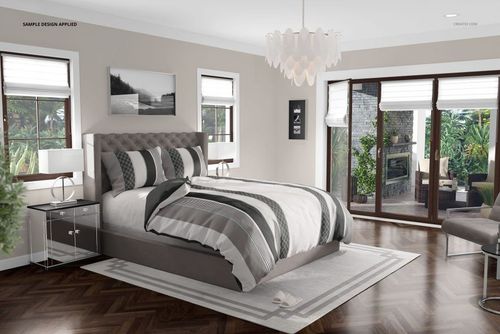 Luxurious bedding mockup featuring a gray upholstered bed with striped linens, shown in a bright, spacious bedroom.