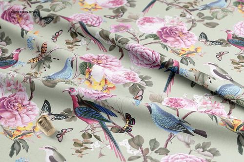 PSD mockup of fabric displaying a detailed botanical design with birds and butterflies, arranged in gentle folds.