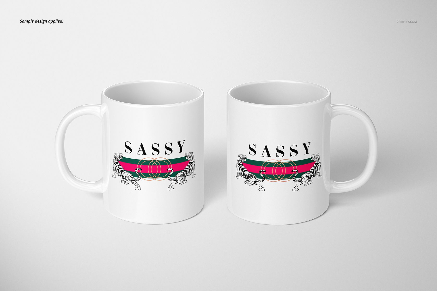 Two white 11oz mugs with handles, featuring a bold SASSY text and striped graphic, shown on a plain surface.