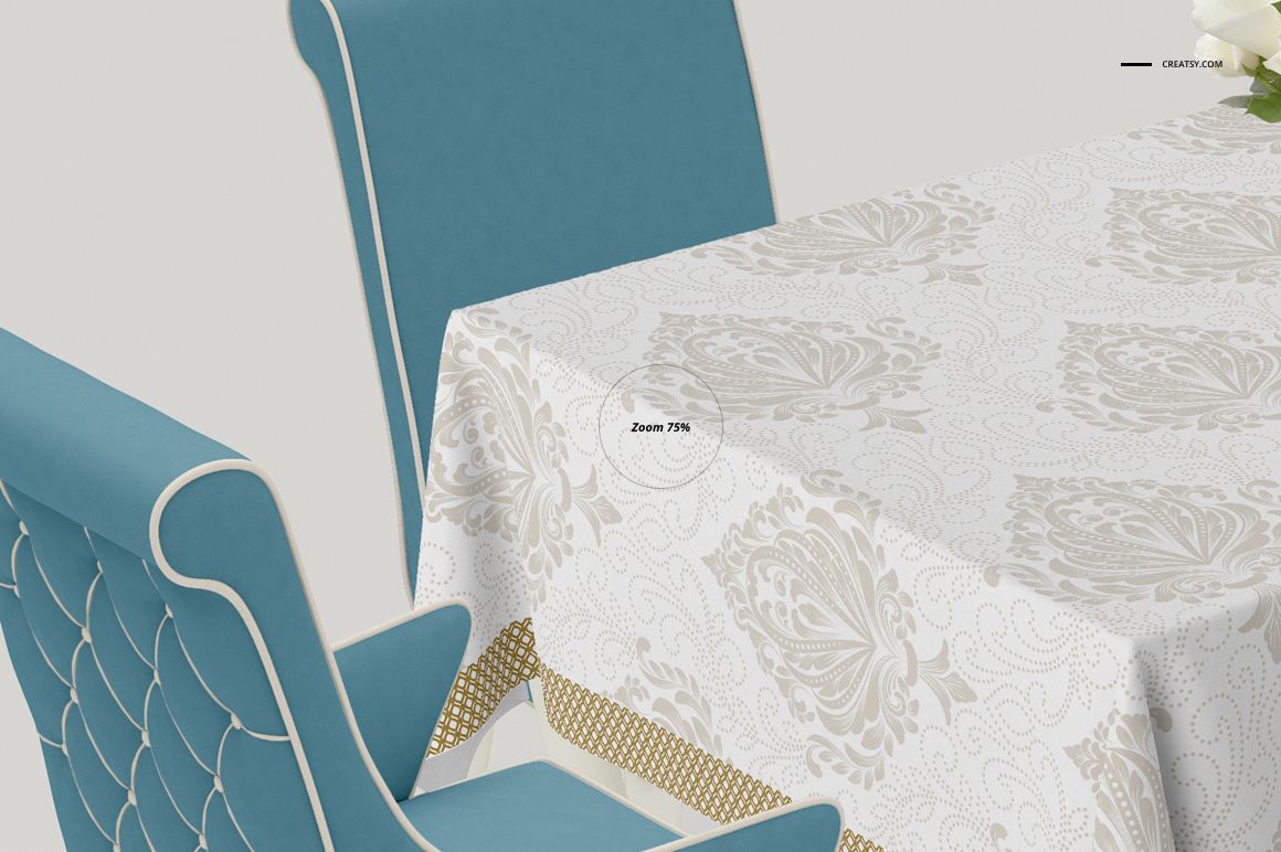 PSD mockup of a patterned tablecloth on a dining table, viewed from the side with teal chairs and a light background.