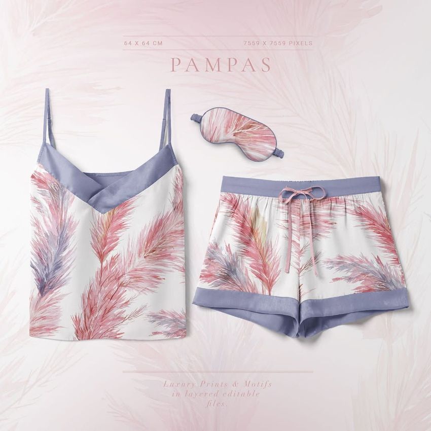 Short silk pajama mockup set with a camisole, shorts, and sleep mask featuring pastel pampas grass patterns on a light background.