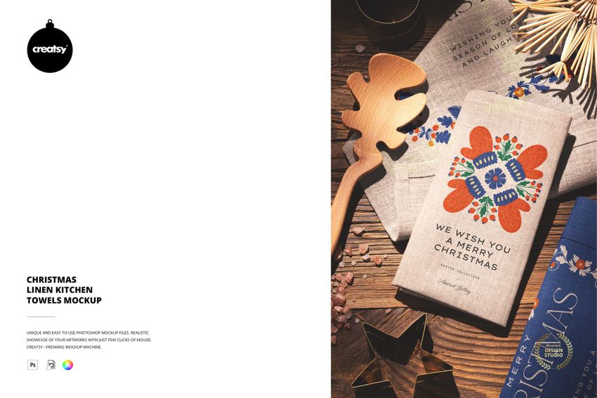 Christmas linen kitchen towels mockup showing a folded towel with festive patterns and text on a wooden surface.