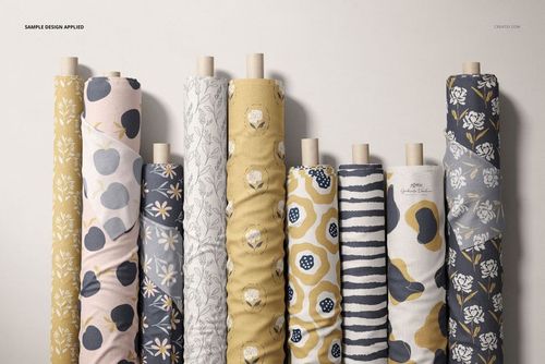 Fabric rolls mockup with diverse patterns including flowers and stripes, shown from the front against a neutral background.