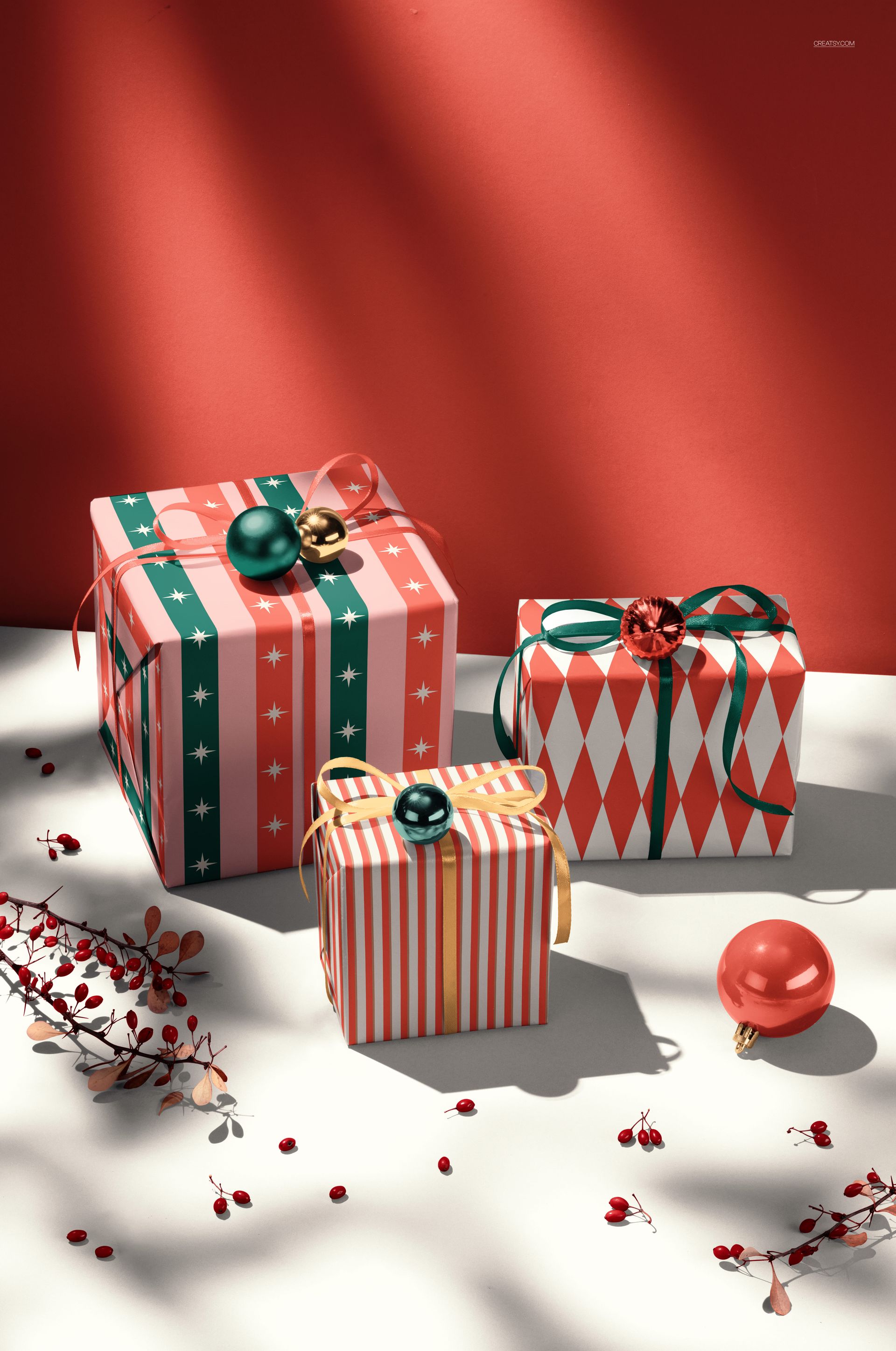 PSD mockup featuring decorative holiday gift boxes in red, green, and gold, surrounded by berries and baubles.