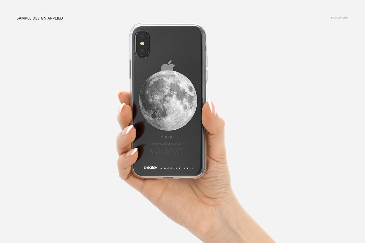 Clear iPhone X case mockup on a black phone, held in a hand, featuring a moon graphic on a white background.