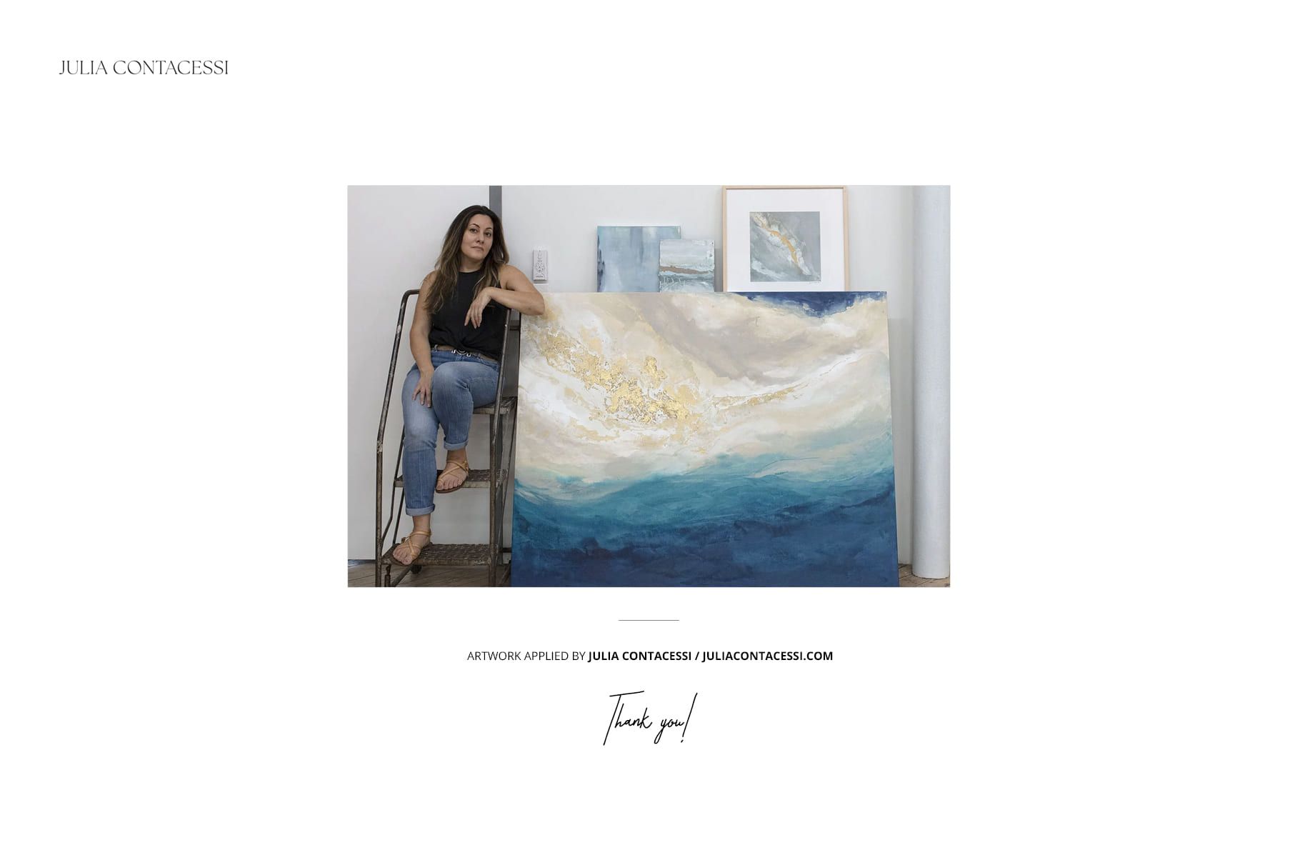 Large abstract painting with blue and white tones displayed on the floor next to a seated person in a modern room.