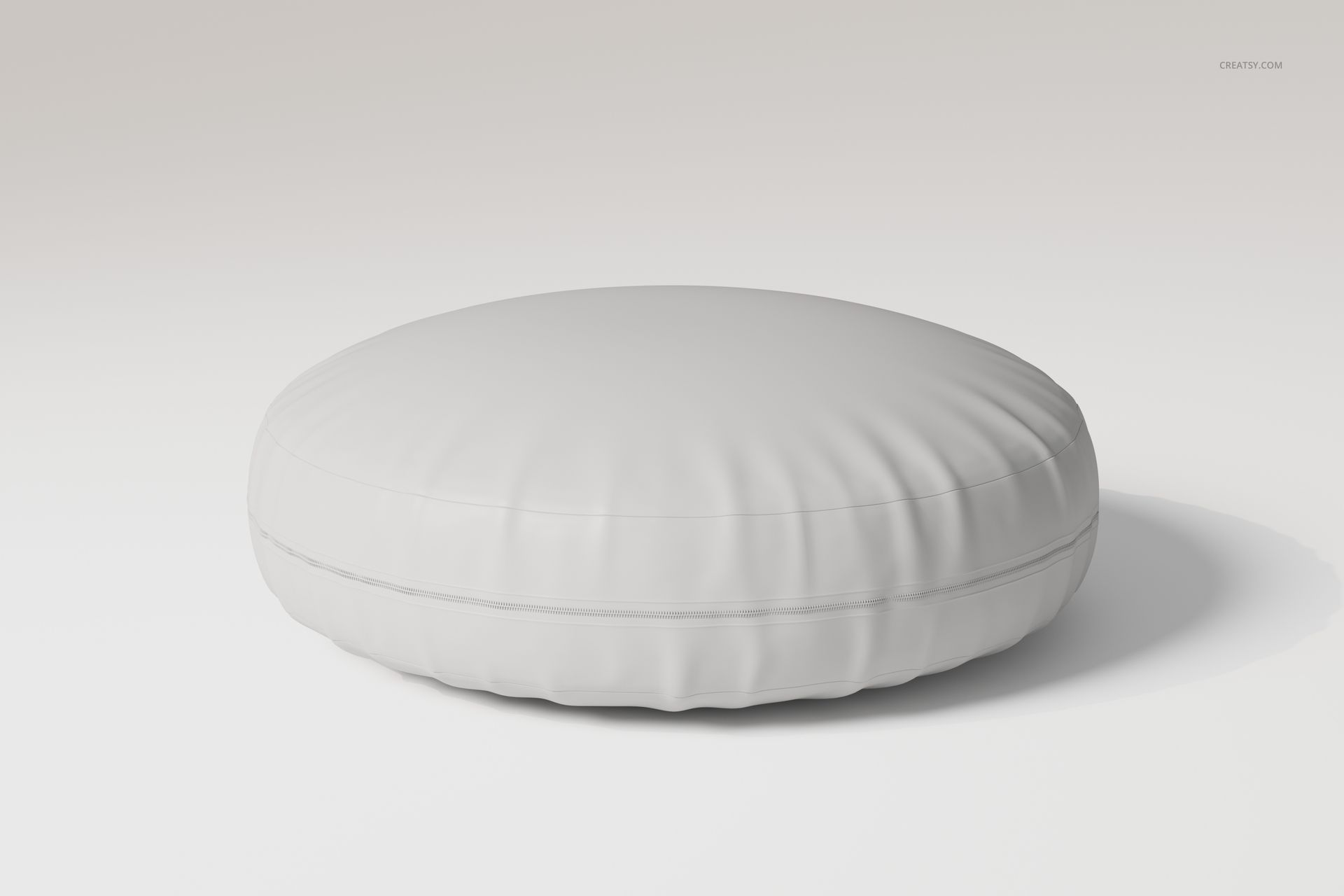Round floor cushion in plain white fabric, shown from a front angle on a neutral background with soft lighting.