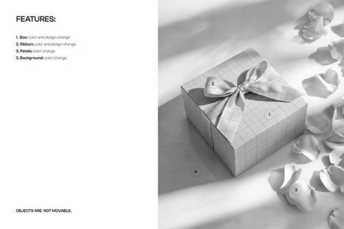 PSD mockup of a square packaging box with a ribbon, surrounded by loose petals and lit with soft shadows.