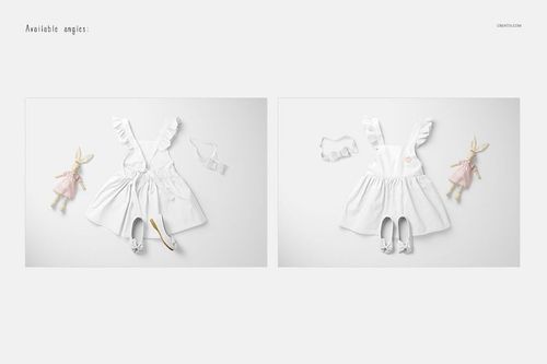 PSD mockup showing a white baby dress laid out with matching shoes, headband, and a doll, photographed from above.