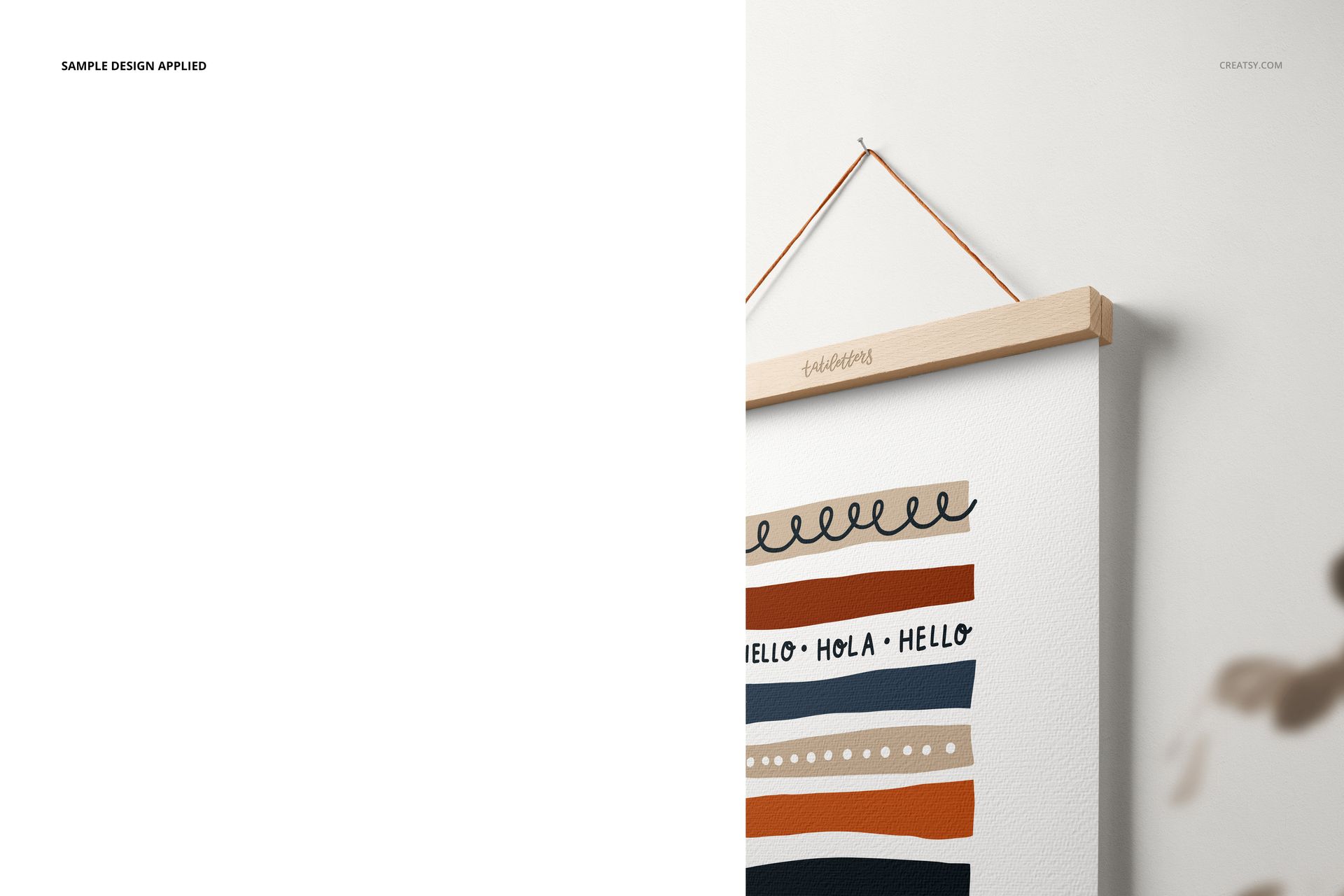 Wooden poster hanger mockup showing an A3 print with colorful horizontal stripes and hand-drawn text.