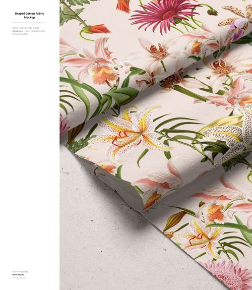 Cotton fabric mockup with vivid pink, orange, and yellow flowers and green leaves, displayed folded on a neutral background.