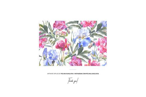 PSD mockup of folded fabric with colorful floral design, including pink peonies and blue irises, centered on white.